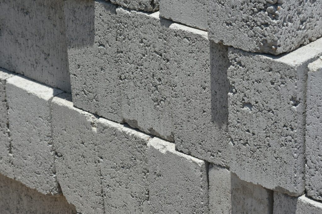 a close up of a brick wall made of cement